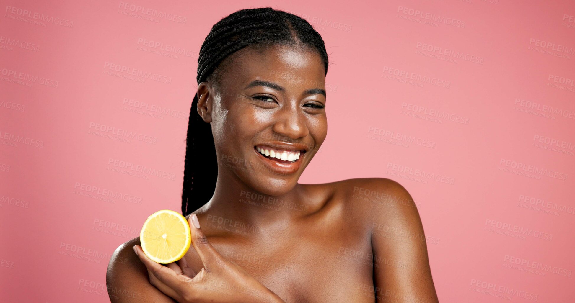 Buy stock photo Portrait, black woman and lemon for skincare in studio for vitamin c, brighten skin and natural detox. Female person, citrus fruit and organic benefits, beauty and exfoliate shine on pink background
