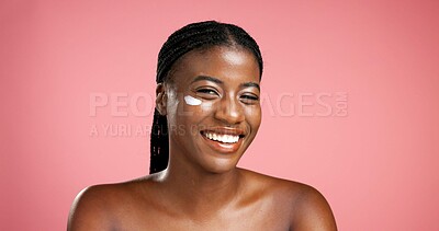 Buy stock photo Portrait, black woman and smile with lotion in studio for beauty, facial hydration and treatment. Happy, female person and collagen cream of self care, sunscreen benefits and shine on pink background