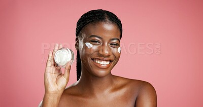 Buy stock photo Portrait, black woman and cream container in studio for beauty, facial hydration and treatment. Happy, female person and lotion product with self care, sunscreen benefits and shine on pink background