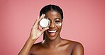 Portrait, black woman and smile with cream in studio for beauty, facial hydration and treatment. Happy, female person and lotion product for self care, sunscreen benefits and shine on pink background