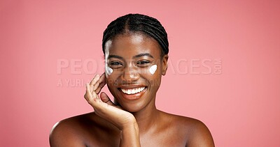 Buy stock photo Portrait, black woman and happy with lotion in studio for beauty, facial hydration and treatment. Smile, female person and collagen cream of self care, sunscreen benefits and shine on pink background