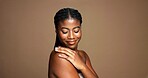 Studio background, shine and woman with smooth skin, smile and treatment for glow and mock up space. Happy, black person and pride for dermatology, beauty and cosmetics for wellness or skincare