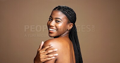 Buy stock photo Shoulder, skincare and smile with portrait of woman in studio for body care, shine or beauty. Glow, dermatology and hydration with female person on brown background for aesthetic, space and happiness