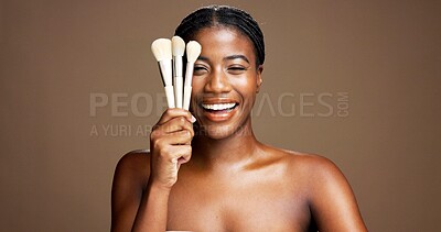 Buy stock photo Portrait, cosmetics and woman with brush for makeup, happy or tool for facial application or beauty. Studio background, self care and black person with equipment for foundation, smile or mockup space