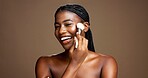 Face, happy and woman with brush for makeup, beauty or equipment for facial application or cosmetic. Studio background, self care and black person with tools for foundation, smile and mockup space