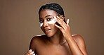 Black woman, portrait and eye mask for dermatology in studio, skincare or reduce puffiness on background. Beauty, skin health or hydration with hyaluronic patches or cosmetic product for dark circles