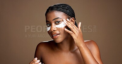 Buy stock photo Black woman, portrait and eye mask for dermatology in studio, skincare or reduce puffiness on background. Beauty, skin health or hydration with hyaluronic patches or cosmetic product for dark circles