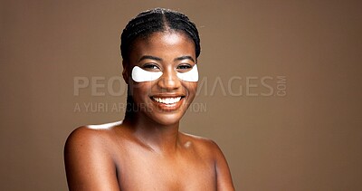 Buy stock photo African woman, smile and eye mask for skincare in studio, dermatology and reduce puffiness on background. Beauty, portrait and hydration with hyaluronic patches or cosmetic product for dark circles