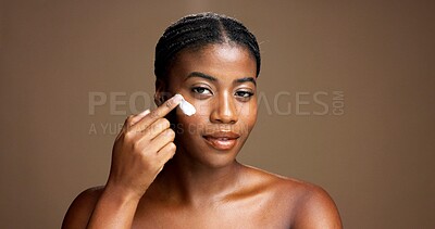 Buy stock photo Cream, skincare and portrait of black woman in studio for beauty product, cosmetics and dermatology. Glow, hyaluronic acid and self care with person and lotion on brown background space for retinol