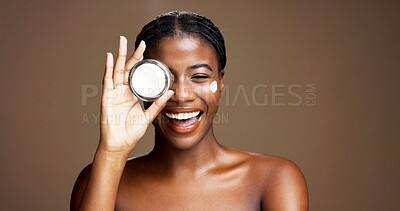 Buy stock photo Cream, cosmetics and portrait of black woman in studio for beauty product, skincare and dermatology. Glow, hyaluronic acid and self care with person and lotion on brown background space for retinol