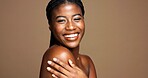 Portrait, black woman and happy for beauty in studio with skincare, facial treatment and results. Smile, female person and natural cosmetics of dermatology, healthy shine and glow on brown background