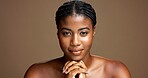 Portrait, African woman and skincare in studio background for beauty, facial treatment and results. Female person, hands together and natural cosmetics for shine, dermatology benefits and wellness