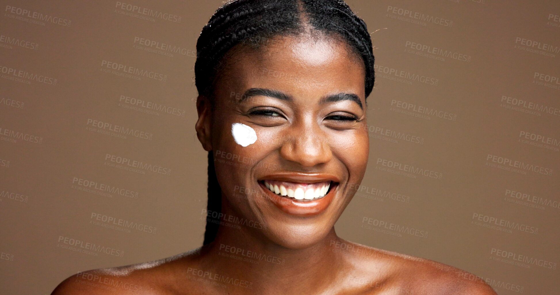 Buy stock photo Skincare, happy or black woman on brown background with face cream, portrait or healthy glow. Space, smile or African person in studio with facial lotion, beauty shine and cosmetics for even tone