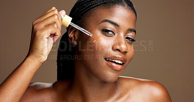 Buy stock photo Serum, cosmetics and portrait of black woman in studio for beauty product, skincare and dermatology. Glow, hyaluronic acid and self care with person and dropper on brown background space for retinol