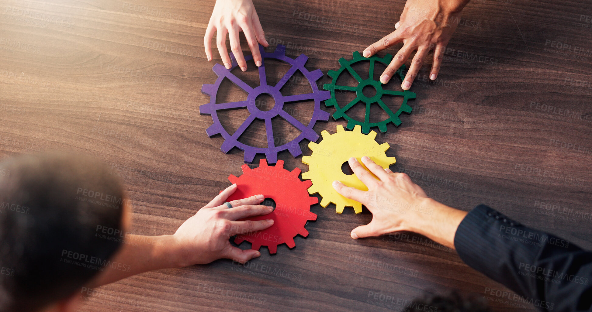 Buy stock photo People, hands and gears with mesh for team building or problem solving together above. Top view, group or community with cog wheels or pieces in unity for support, connection or critical solution