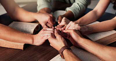 Buy stock photo Bible, holding hands and religion with people in home together for Christian belief, faith or prayer. Book, spirituality and trust with group of friends in apartment for learning or God worship
