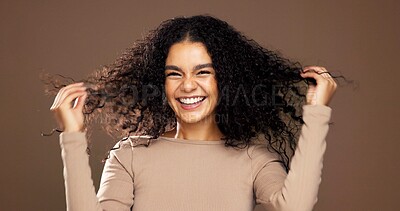 Buy stock photo Studio, hair care and portrait of happy woman with growth, beauty and volume on brown background. Curly hairstyle, smile and female model with cosmetics for hairdresser, texture and salon treatment