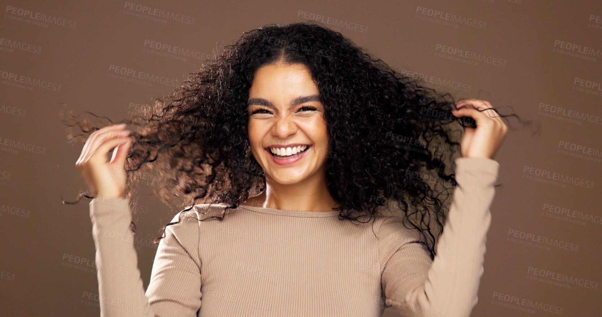 Buy stock photo Studio, hair care and portrait of happy woman with growth, beauty and volume on brown background. Curly hairstyle, smile and female model with cosmetics for hairdresser, texture and salon treatment