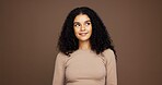 Thinking, cosmetics and woman in studio with ideas for makeup, natural or facial glow routine. Happy, brainstorming and female person with beauty, glamour or cosmetology treatment by brown background