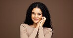 Makeup, portrait and happy woman in studio for cosmetics, beauty or facial glow with glamour. Smile, natural and female person from Colombia with face cosmetology for confidence by brown background.