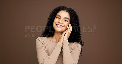 Buy stock photo Cosmetics, portrait and woman in studio for beauty, makeup or positive for facial glow. Smile, natural and female person from Colombia with face cosmetology for confidence by brown background.
