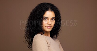 Buy stock photo Portrait, hair care and woman with natural beauty, growth and volume on brown studio background. Curly hairstyle, confident model and cosmetics for hairdresser, salon or texture with mockup space