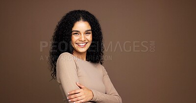 Buy stock photo Portrait, hair care and confident woman with beauty in studio, growth and volume on brown background. Curly hairstyle, happy model and cosmetics for hairdresser with arms crossed with mockup space