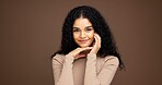 Makeup, portrait and woman in studio for beauty, cosmetics or facial glow with glamour. Smile, natural and female person from Colombia with face cosmetology for confidence by brown background.