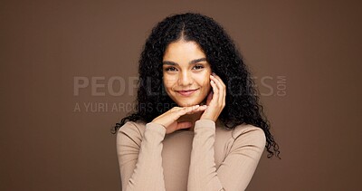 Buy stock photo Makeup, portrait and woman in studio for beauty, cosmetics or facial glow with happiness. Smile, natural and female person from Colombia with face cosmetology for confidence by brown background.