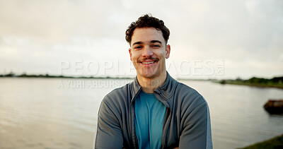Buy stock photo Fitness, lake and portrait with man outdoor in nature for cardio, running or training routine. Exercise, morning and smile with runner or sports athlete in park for challenge, improvement or workout
