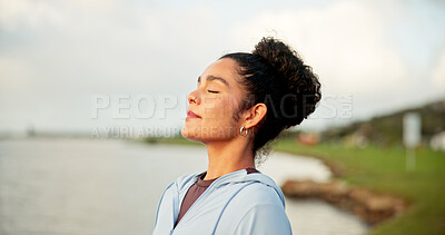 Buy stock photo Breathing, exercise and meditation with woman at lake in nature for awareness, balance or wellness. Eyes closed, fitness and zen with calm person outdoor in park for inner peace or mindfulness