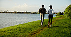 Exercise, running and sky with couple outdoor at lake in nature for cardio training from back. Environment, field and fitness with people on space in park together for health, wellness or workout