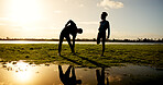 Silhouette, fitness or stretching with couple at lake for workout preparation, exercise or training. Active, man and woman in nature with warm up for physical activity, health or wellness at river