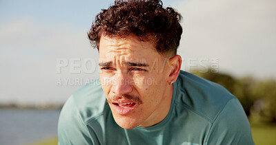 Buy stock photo Tired, athlete and man for fitness outdoor from running, sports exercise and workout break. Thinking, male person and rest with breathing recovery, cardio training and marathon burnout at park