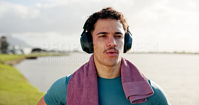 Buy stock photo Running, thinking or man in lake with headphones for outdoor training, workout or exercise. Towel, resting and sports athlete on break for streaming radio, music audio or fitness podcast to relax