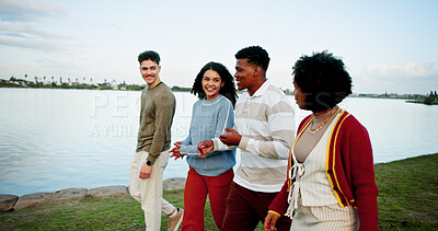 Buy stock photo Walking, happy and friends outdoor by lake on vacation, getaway or weekend trip together. Talking, bonding and group of young people in nature for reunion, gathering or catch up on holiday travel.
