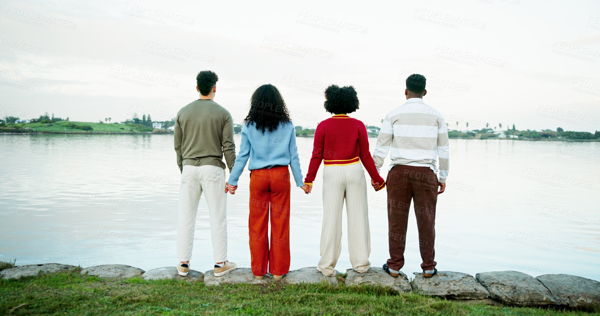 Buy stock photo Holiday, nature and friends holding hands at lake with trip support, view and vacation sightseeing. Back, group and people bonding together outdoor for winter getaway, connection and travel adventure
