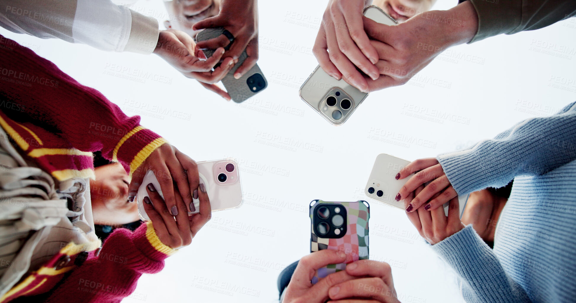 Buy stock photo Phone, sky and social media with hands of friends outdoor in circle for connection from below. App, text message and typing with student people in nature for chatting online or mobile communication