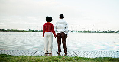 Buy stock photo Back view, lake and couple holding hands on vacation, holiday and travel with space in nature. Pier, man and woman sightseeing together by water for love, support and bonding with connection on trip