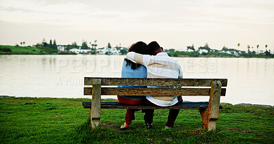 Buy stock photo Back view, lake and couple on park bench on vacation, holiday and hug for bonding. Embrace, man and woman sightseeing by water together for love, support or connection for relax with space for travel
