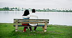 Lake view, hug and couple on park bench on vacation, holiday and back for bonding. Embrace, man and woman sightseeing by water together for love, support or connection to relax with space for travel