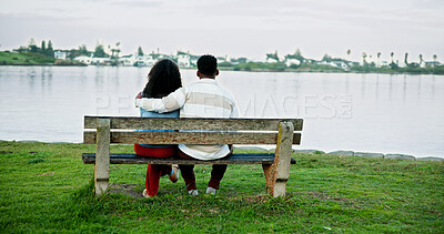 Buy stock photo Lake view, hug and couple on park bench on vacation, holiday and back for bonding. Embrace, man and woman sightseeing by water together for love, support or connection to relax with space for travel