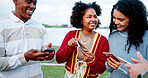 Phone, smile and social media with students outdoor at lake for college acceptance notification. Admission, app and good news with excited people in nature for university communication as friends