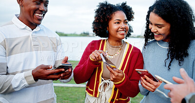 Buy stock photo Phone, smile and social media with students outdoor at lake for college acceptance notification. Admission, app and good news with excited people in nature for university communication as friends
