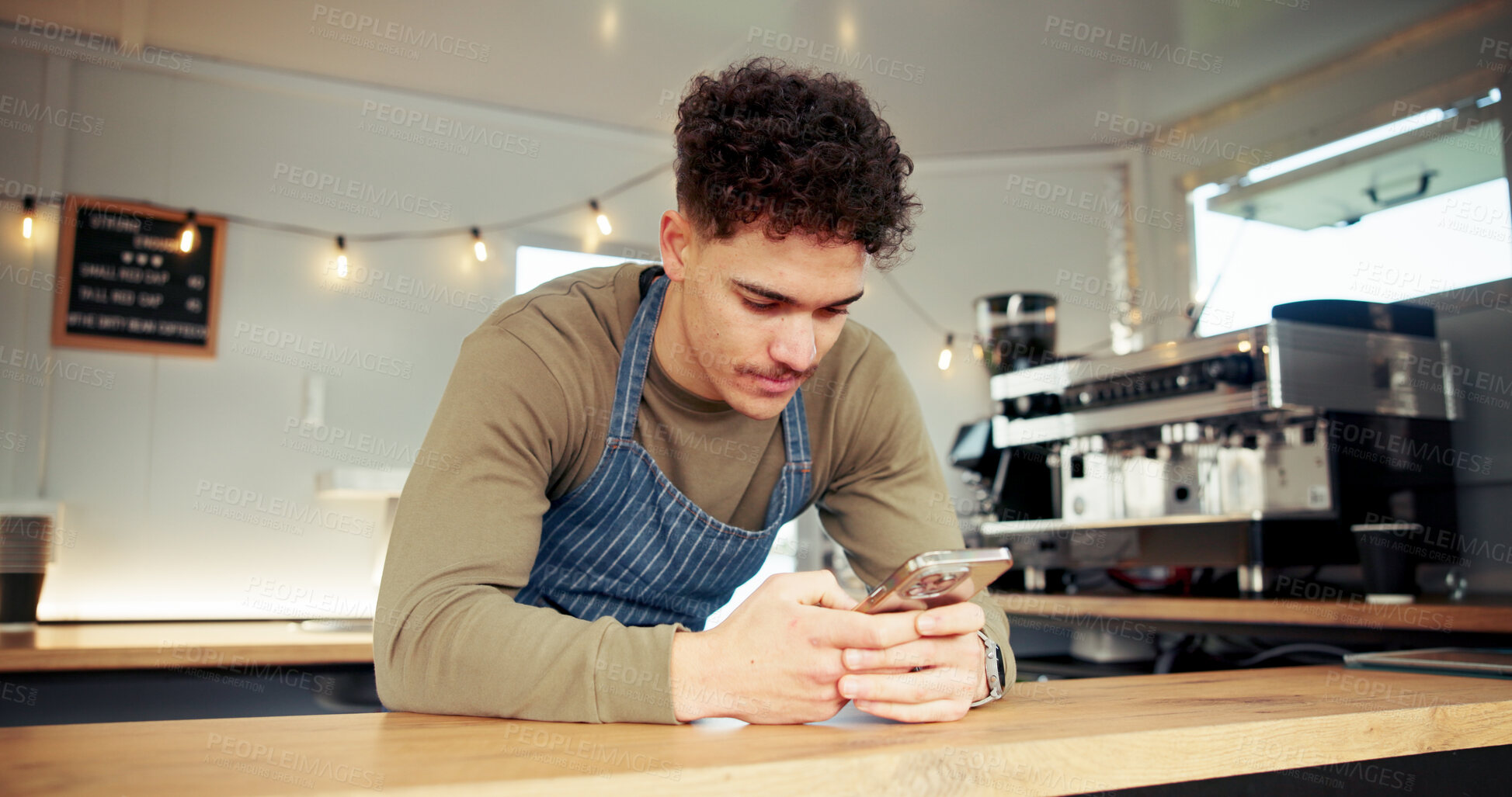 Buy stock photo Food truck, waiter and man with phone at counter for social media, internet and online on break. Mobile cafe, restaurant vendor and person on smartphone for typing message, chat and connection
