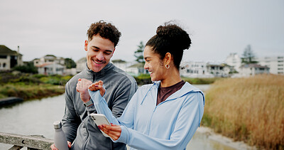 Buy stock photo Fitness, phone and couple fist bump outdoor for success, support and workout goal. Man, woman and hands together for sports celebration, happiness or achievement with mobile app for exercise progress