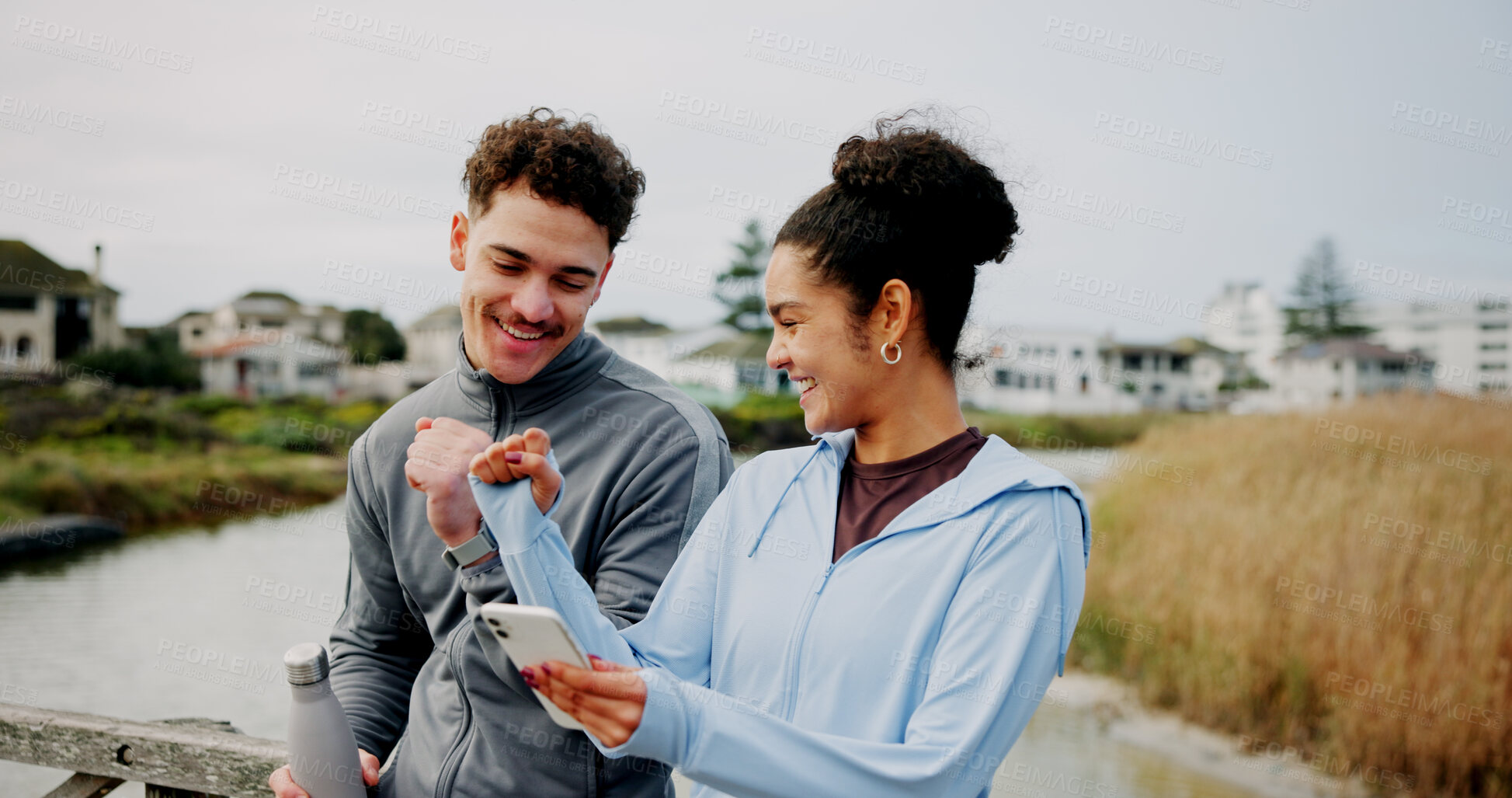 Buy stock photo Fitness, phone and couple fist bump outdoor for success, support and workout goal. Man, woman and hands together for sports celebration, happiness or achievement with mobile app for exercise progress