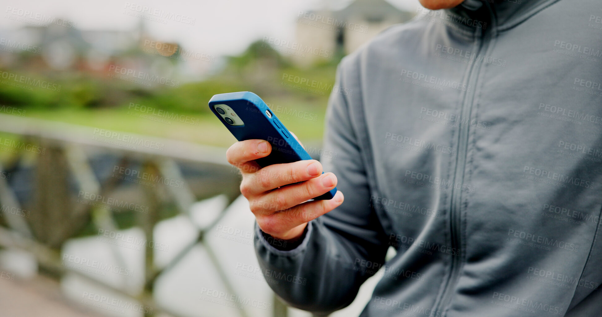 Buy stock photo Exercise, break and hands with phone on bridge for fitness app, check stats or workout performance. Runner, person and smartphone in nature for cardio progress, track running speed and training timer