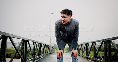 Buy stock photo Running, tired and man on bridge rest for exercise, marathon training and workout for health. Sports, runner and person with fatigue, exhausted and breathe outdoor for fitness, cardio and endurance
