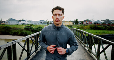 Buy stock photo Running, winter and man on bridge for exercise, marathon training and workout for challenge. Sports, runner and person for wellness, performance and health outdoor for endurance, cardio and fitness